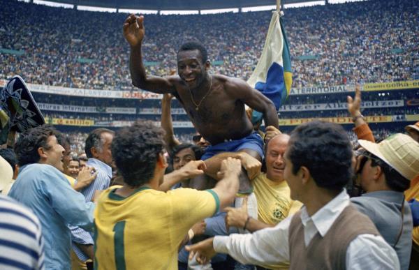 FILE - Brazil's Pelé is hoisted on the shoulders of his teammates after Brazil won the World Cup final against Italy, 4-1, in Mexico City's Estadio Azteca, June 21, 1970. 