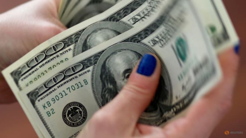 Dollar slides in thin Black Friday trading on bets rates have peaked