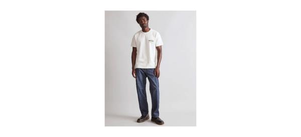 a man wearing a white shirt and jeans