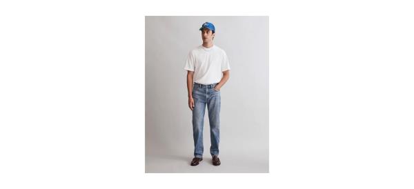a man wearing a white shirt and jeans