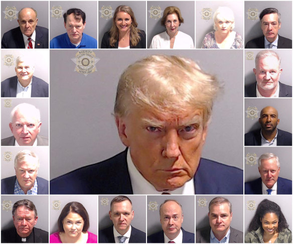 Police mugshots of former US president Do<em></em>nald Trump and the other 18 people charged with trying to overturn the election. Giuliani is top left.