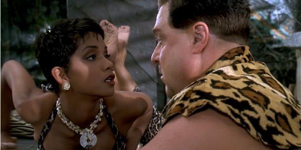 Halle Berry as Miss Stone trying to seduce Fred Flintstone