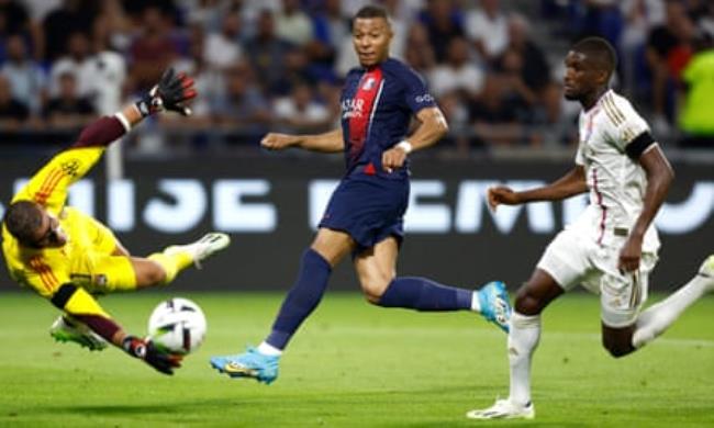 Kylian Mbappé scores PSG’s fourth goal in the first half against Lyon.